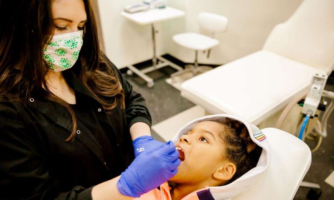 Dr. Christen Massey working on a happy patient in metairie 